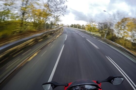 Motorcyclist riding along open road
