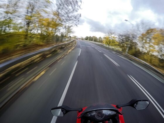 Motorcyclist riding along open road