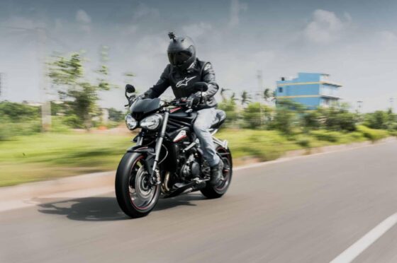 Motorcyclist riding on open road