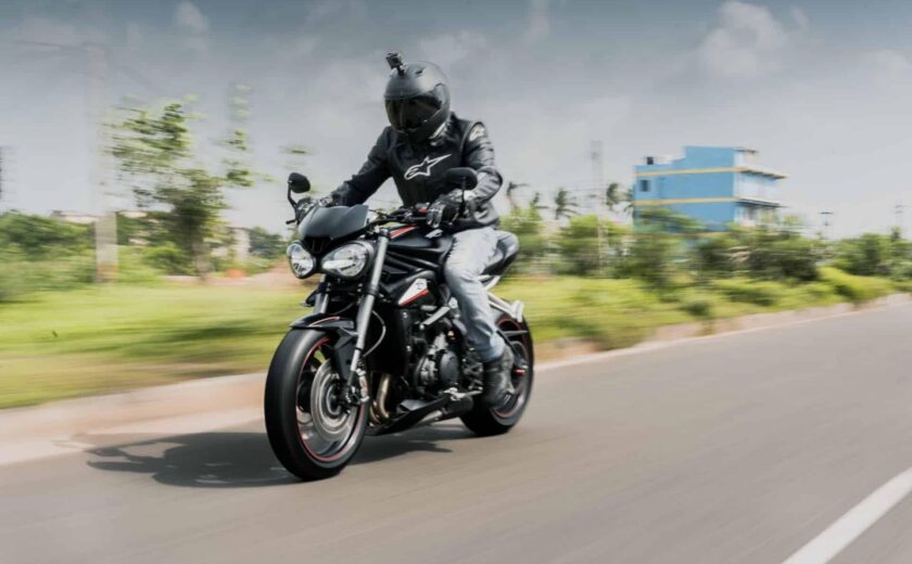 Motorcyclist riding on open road