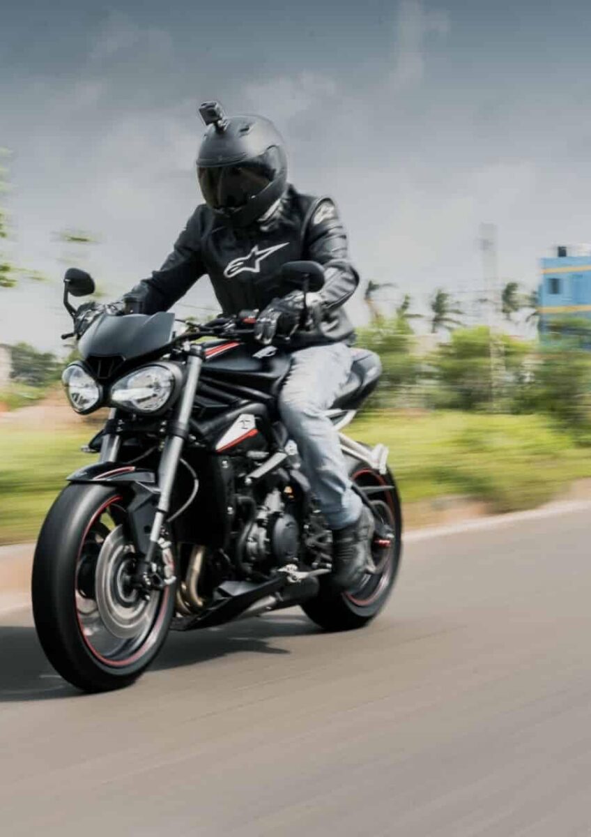 Motorcyclist riding on open road