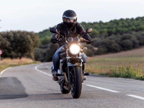 Motorcyclist riding on rural road