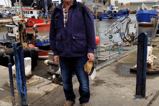Mr Hawkes standing at marina