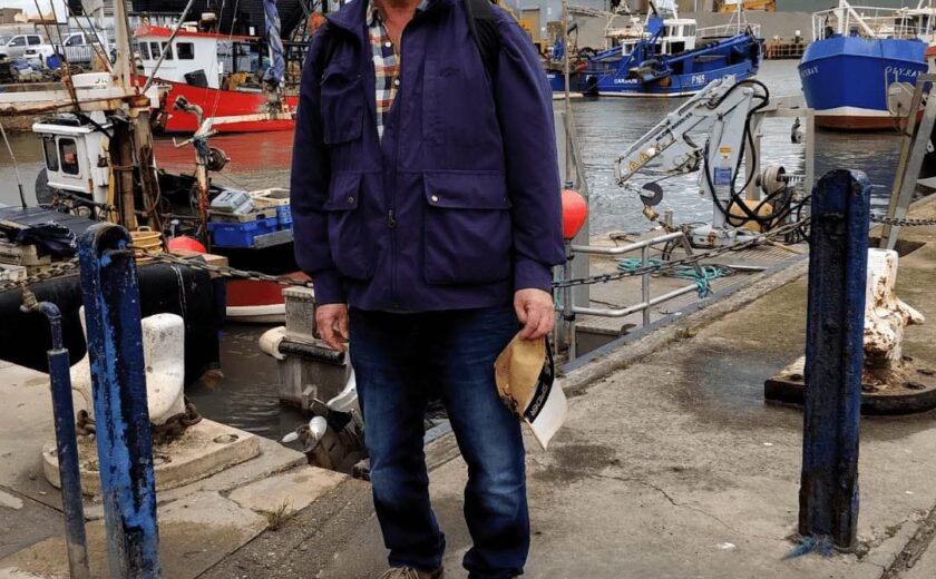 Mr Hawkes standing at marina