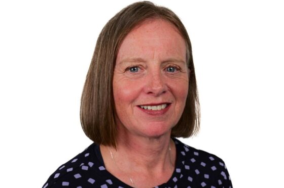Nadia Kerr smiling in professional headshot