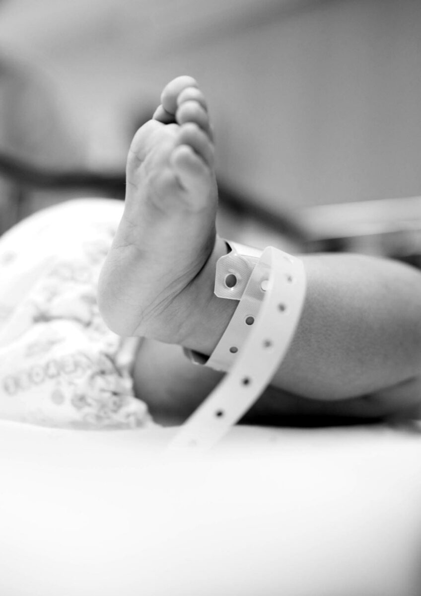 Newborn baby wearing hospital wristband