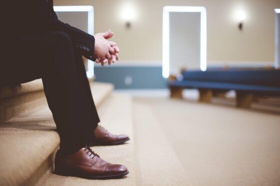 Person sitting alone in hospital waiting area