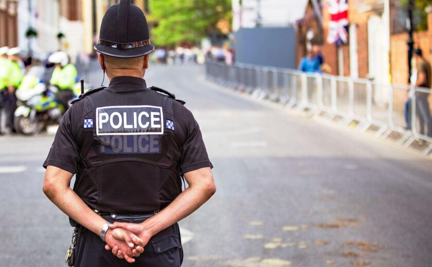Police officer standing on city street