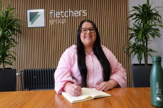 Sophie McGarry seated at Fletchers reception desk