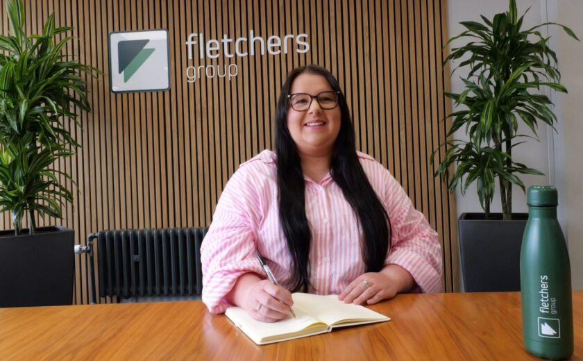 Sophie McGarry seated at Fletchers reception desk