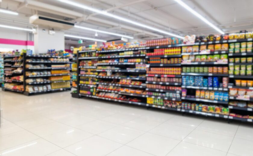 Supermarket aisle with stocked shelves