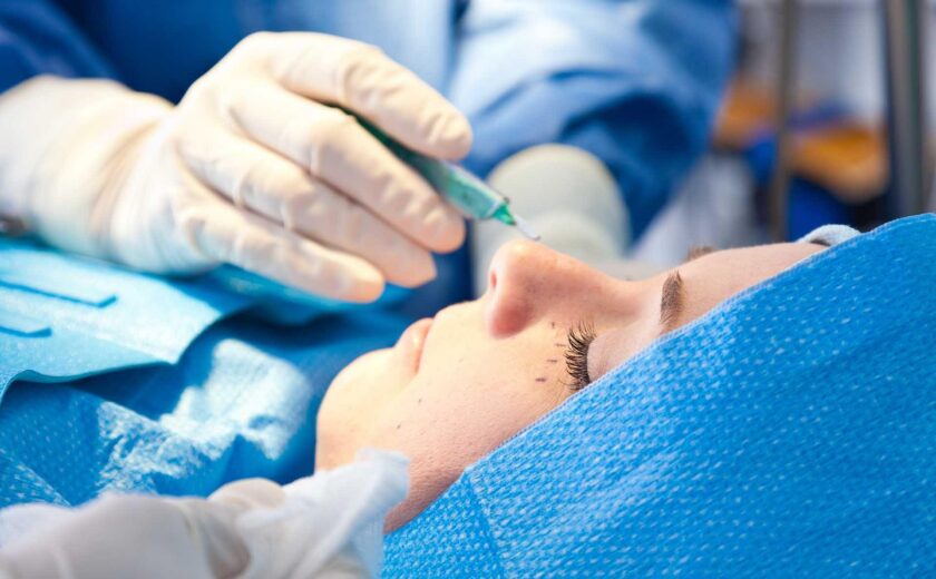 Surgeon operating on patient's eye