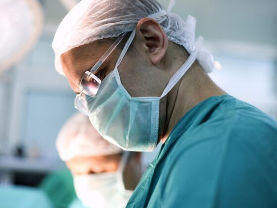 Surgeon wearing mask in operating theatre
