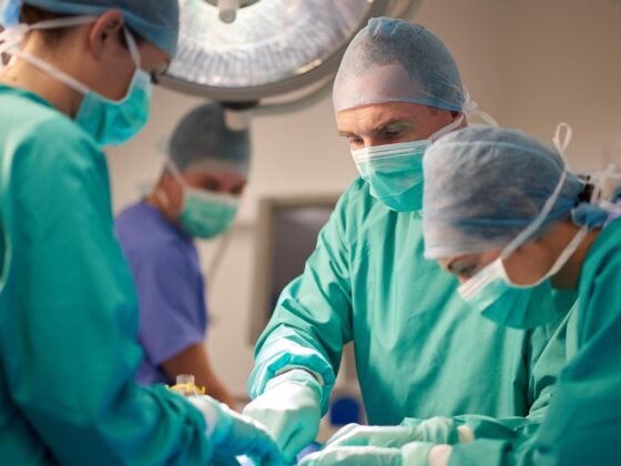 Surgical team operating in theatre