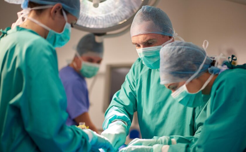 Surgical team operating in theatre