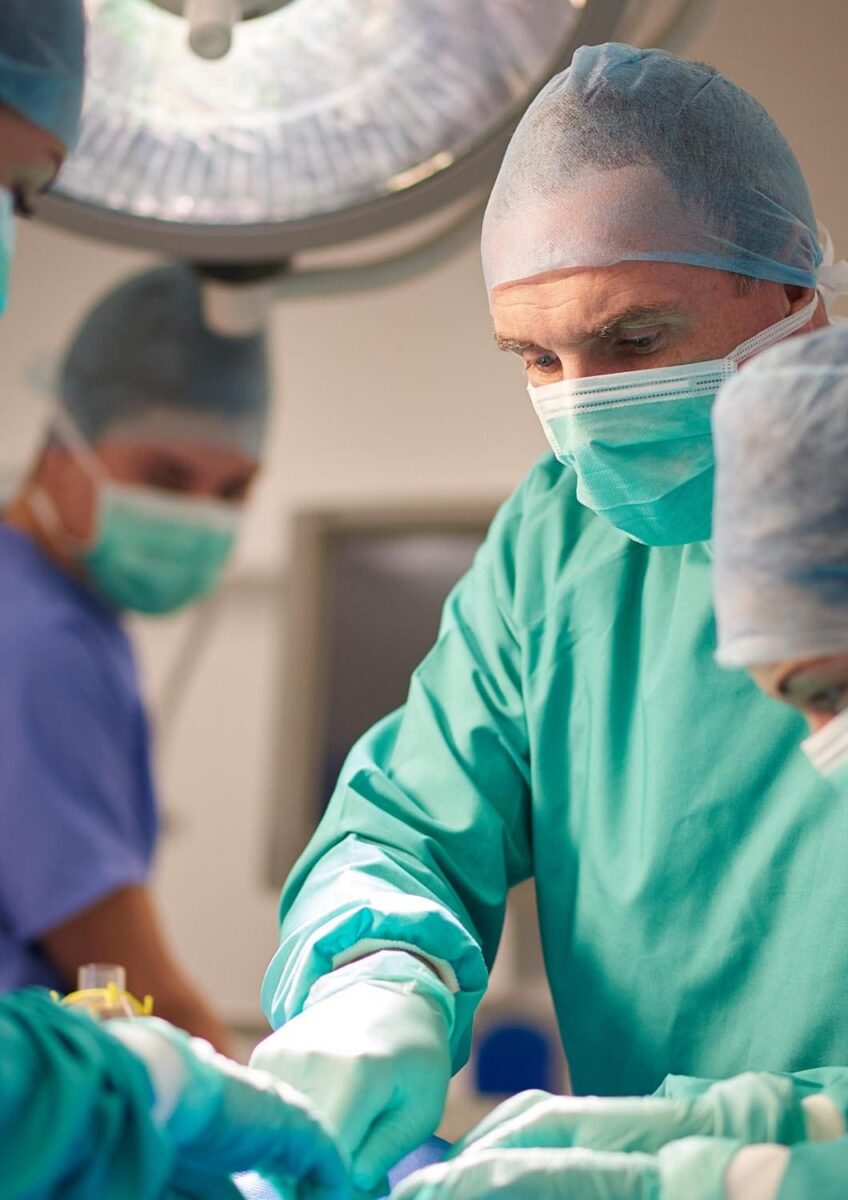 Surgical team operating in theatre