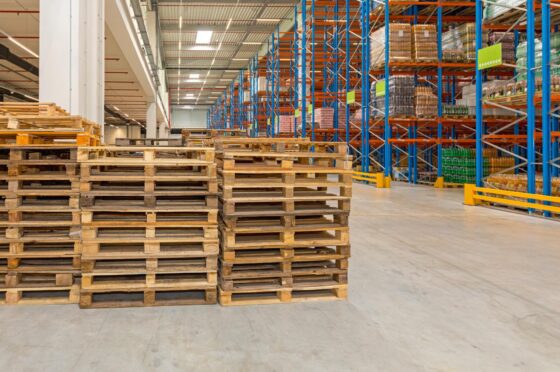 Warehouse pallets beside racking