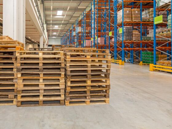 Warehouse pallets beside racking