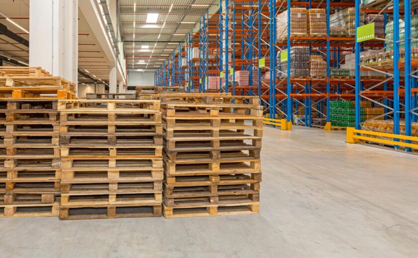 Warehouse pallets beside racking
