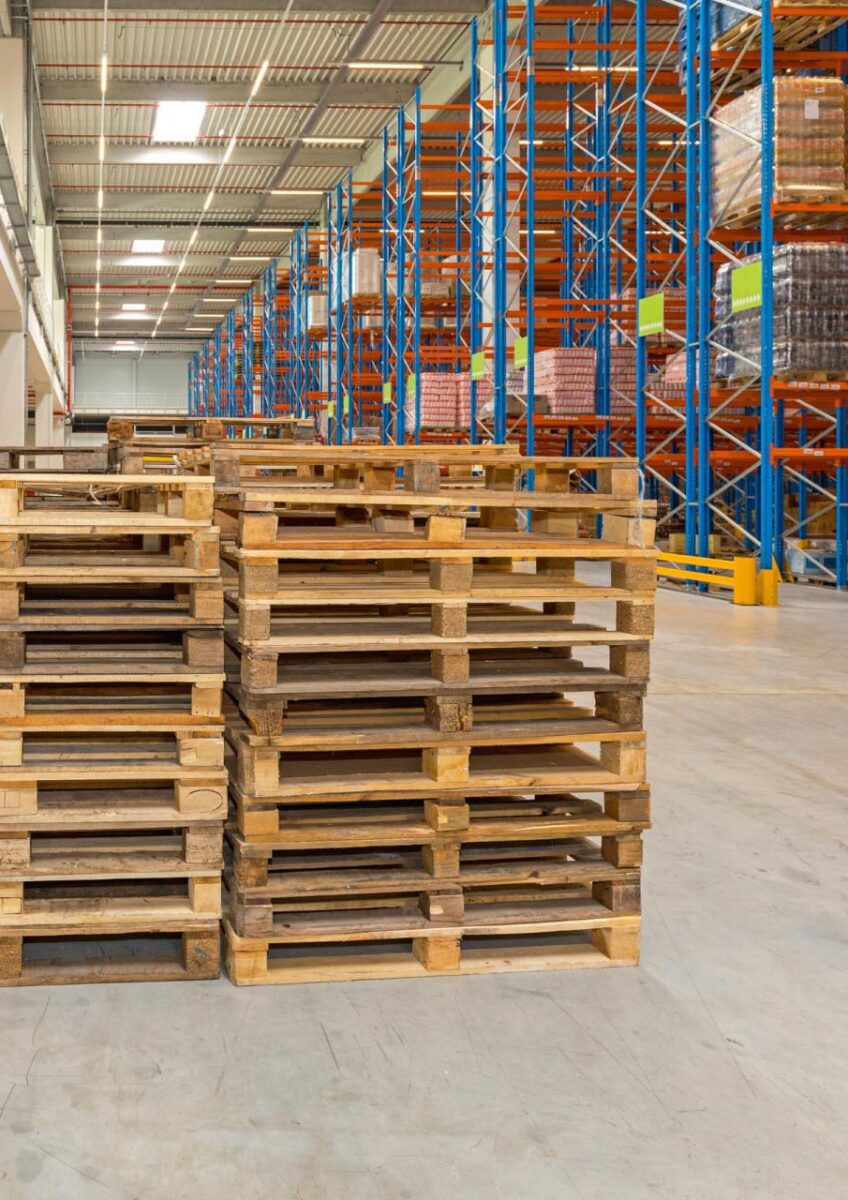 Warehouse pallets beside racking