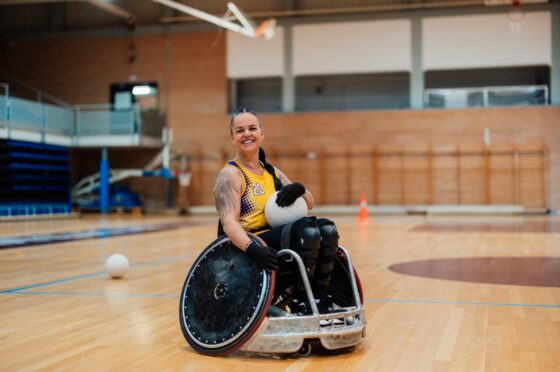 Wheelchair rugby player on indoor court