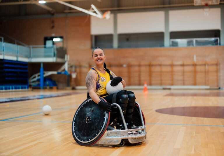 Wheelchair rugby player on indoor court