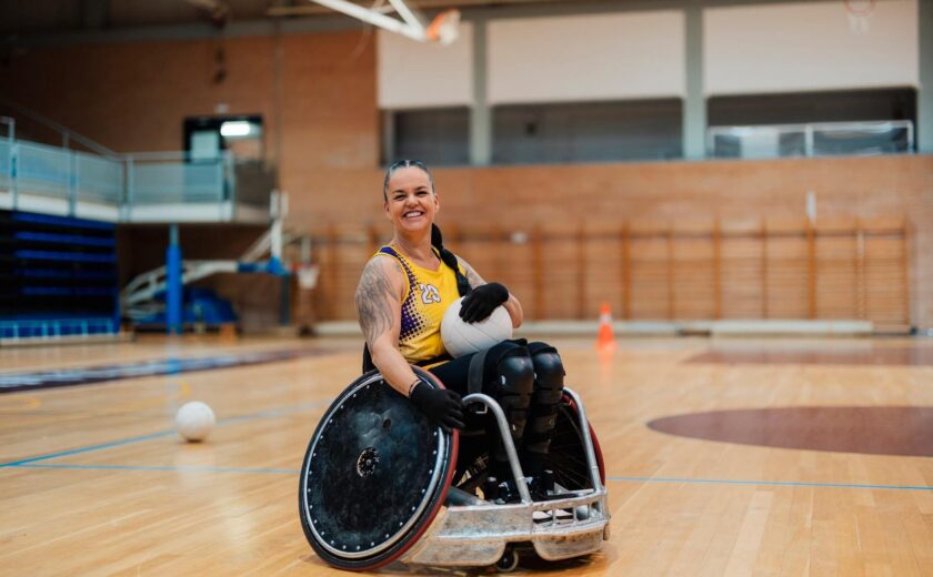 Wheelchair rugby player on indoor court