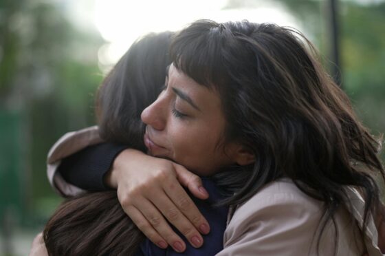 Woman hugging friend
