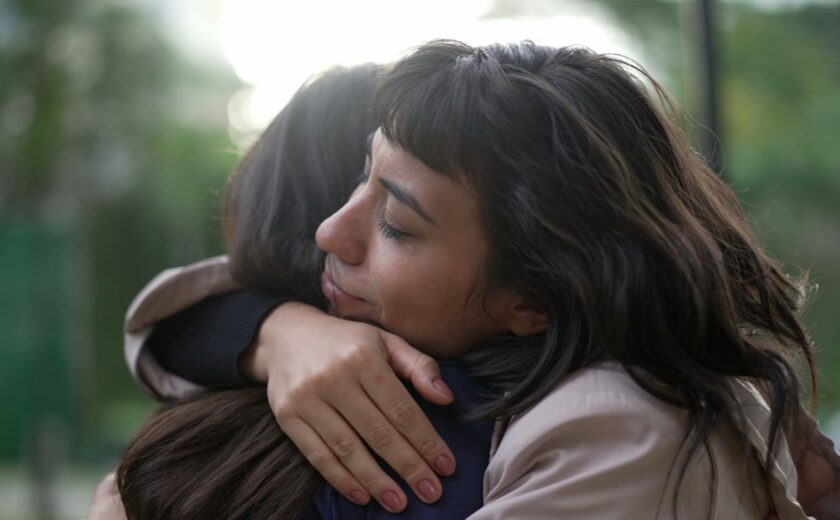Woman hugging friend