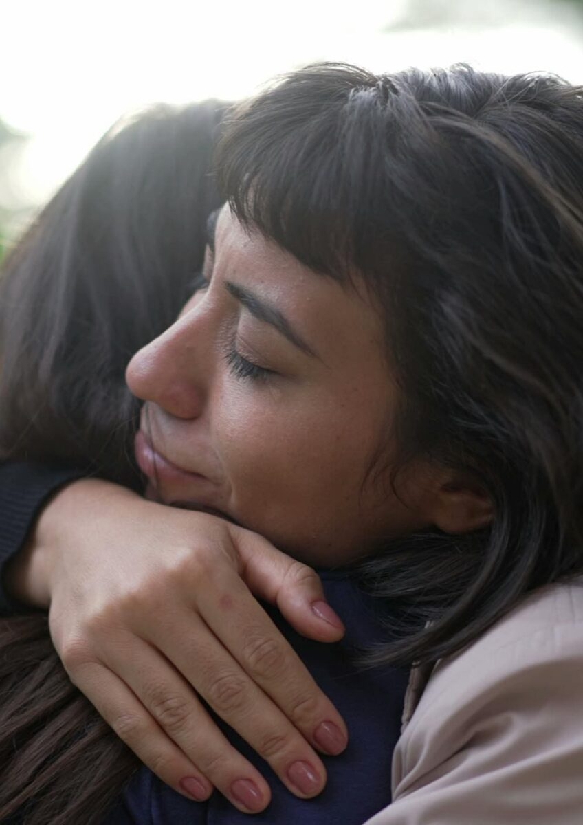 Woman hugging friend