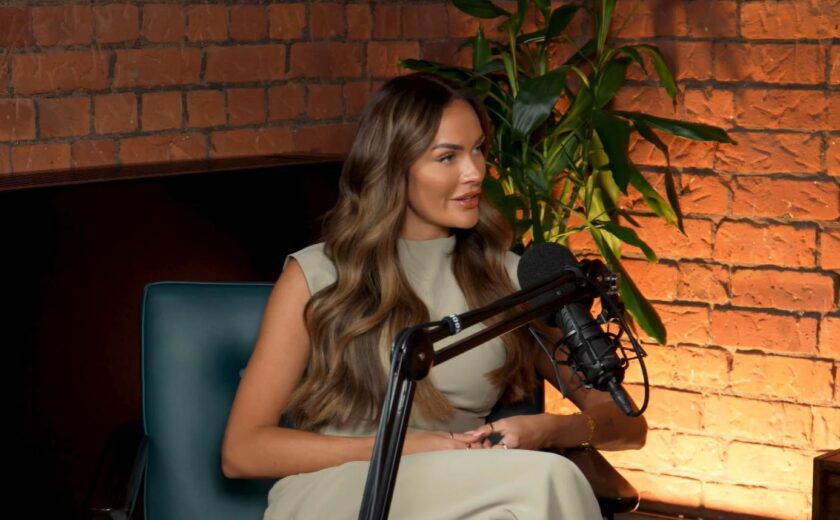 Woman speaking into podcast microphone