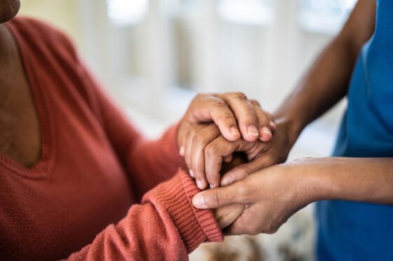 Women holding rassurance hands