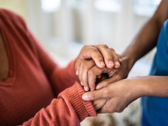 Women holding rassurance hands
