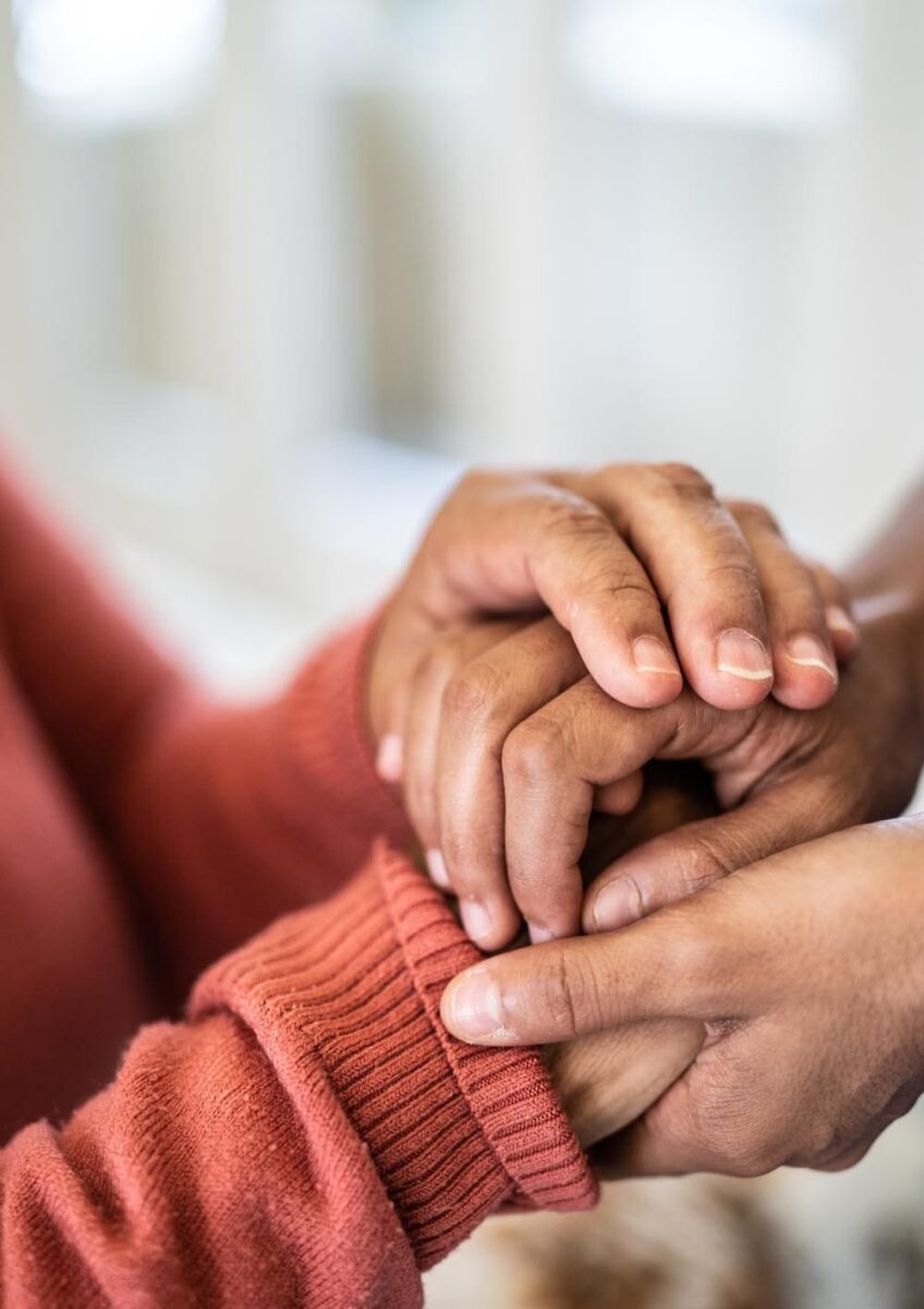 Women holding rassurance hands