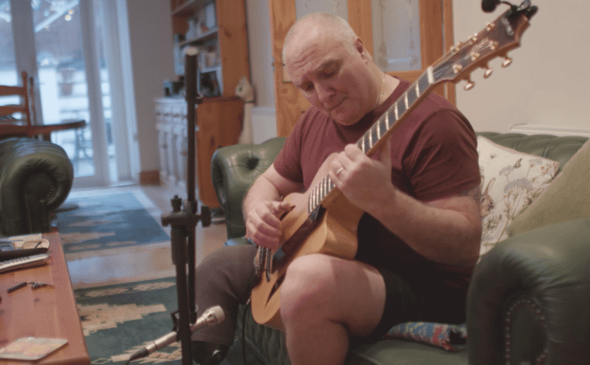 Tony playing guitar