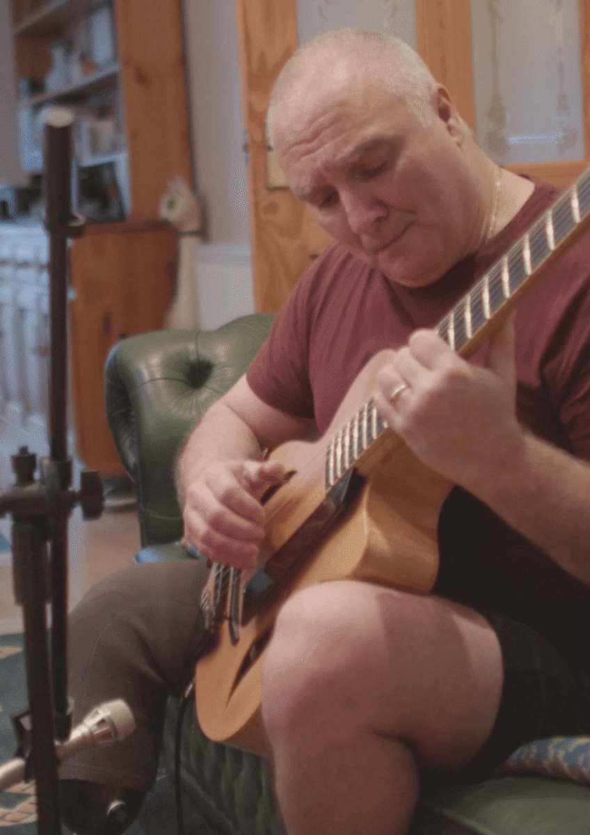Tony playing guitar