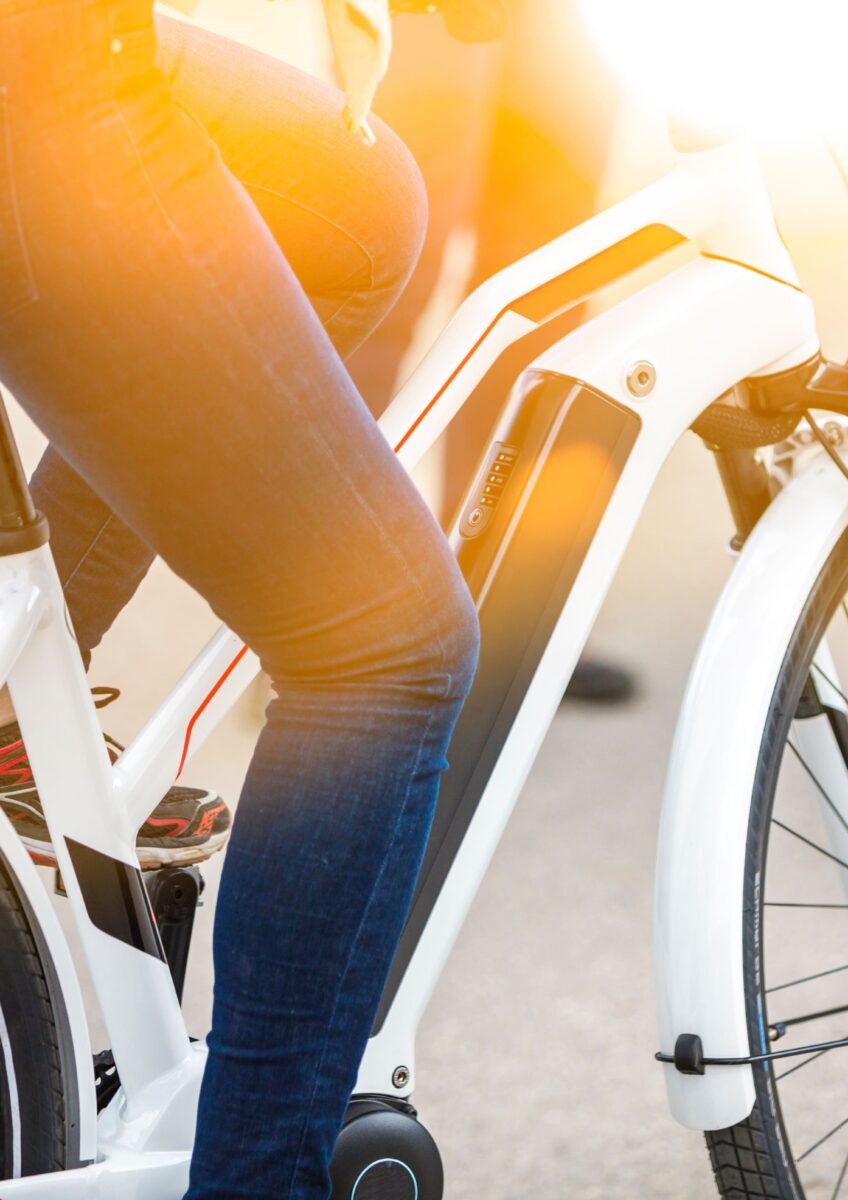 Close-up of battery pack on modern white electric bicycle