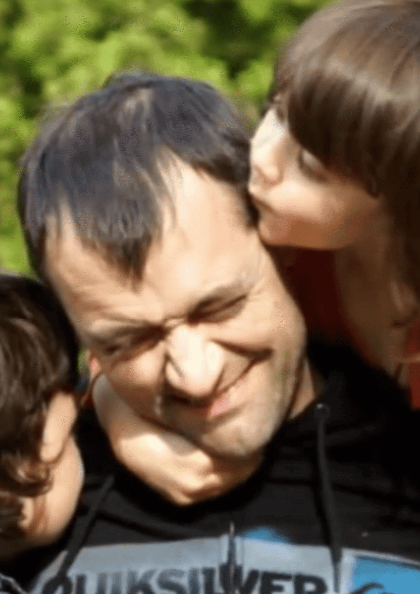 Sarah's husband Nick with their two children