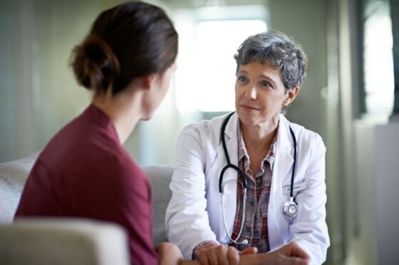 woman-sat-talking-with-doctor